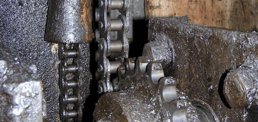 A mechanical unit with chains and gears